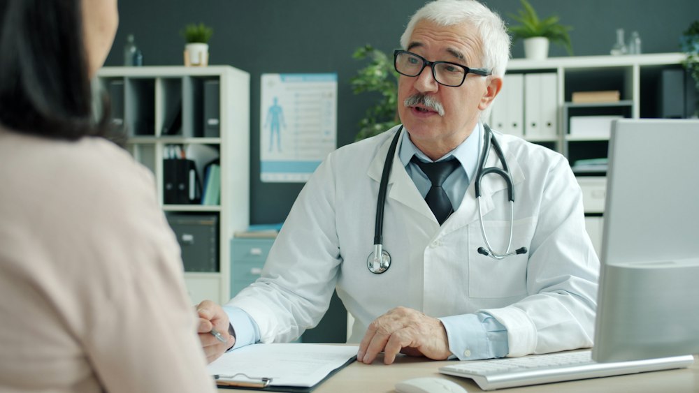 Psychiatric healthcare provider conducting a telehealth video consultation with a patient